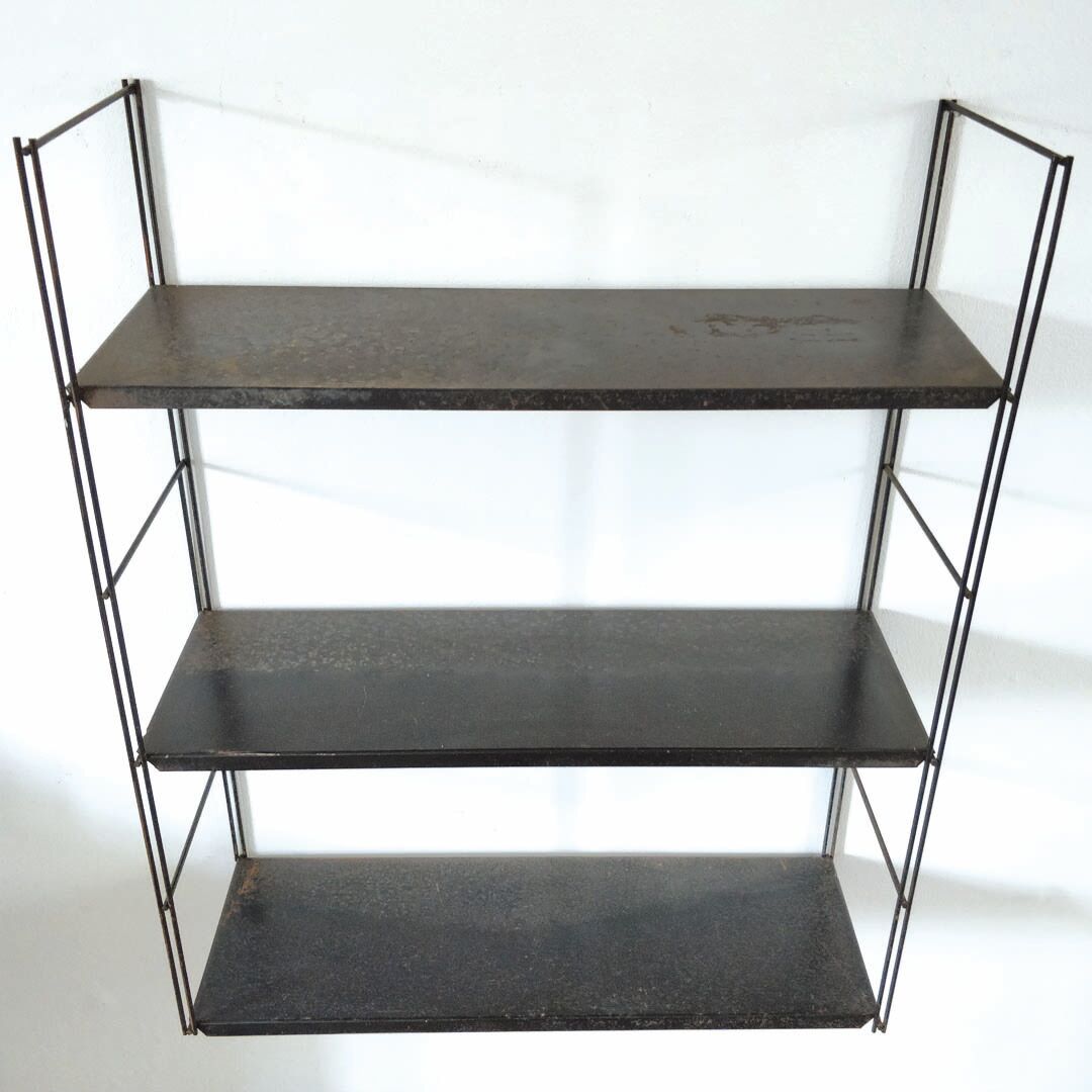 Patinated metal wall shelf