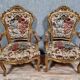 Pair of carved and gilded cabriolet armchairs in the Louis XV style.