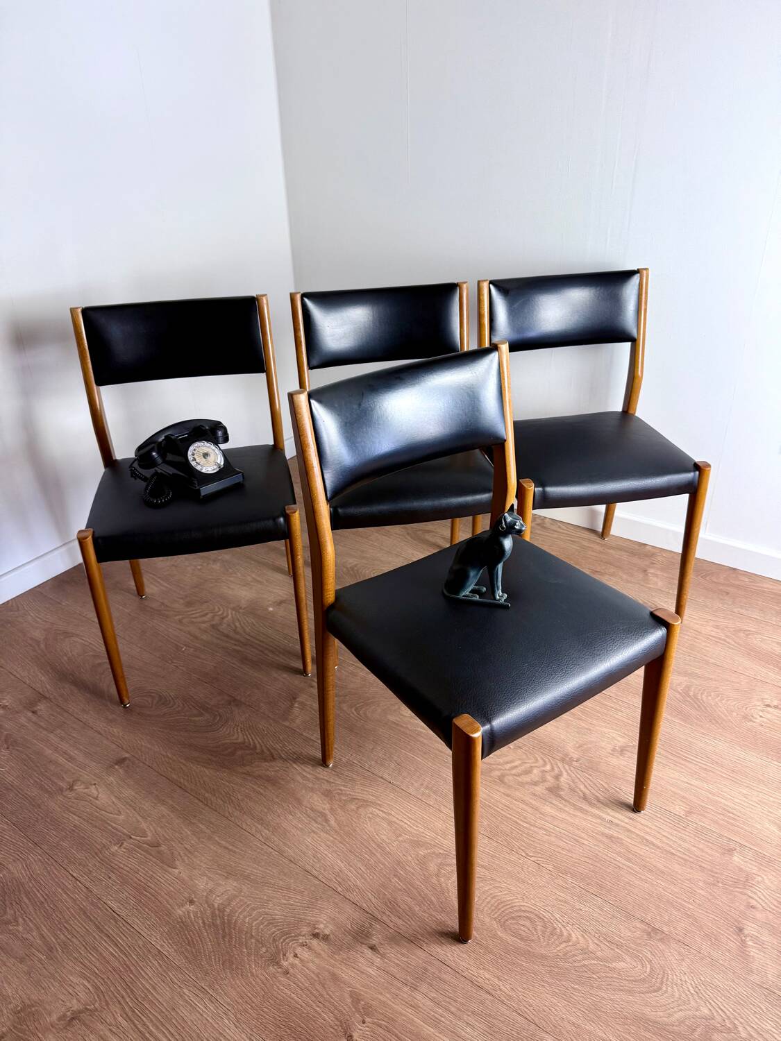 Set of 4 wooden and black leatherette chairs