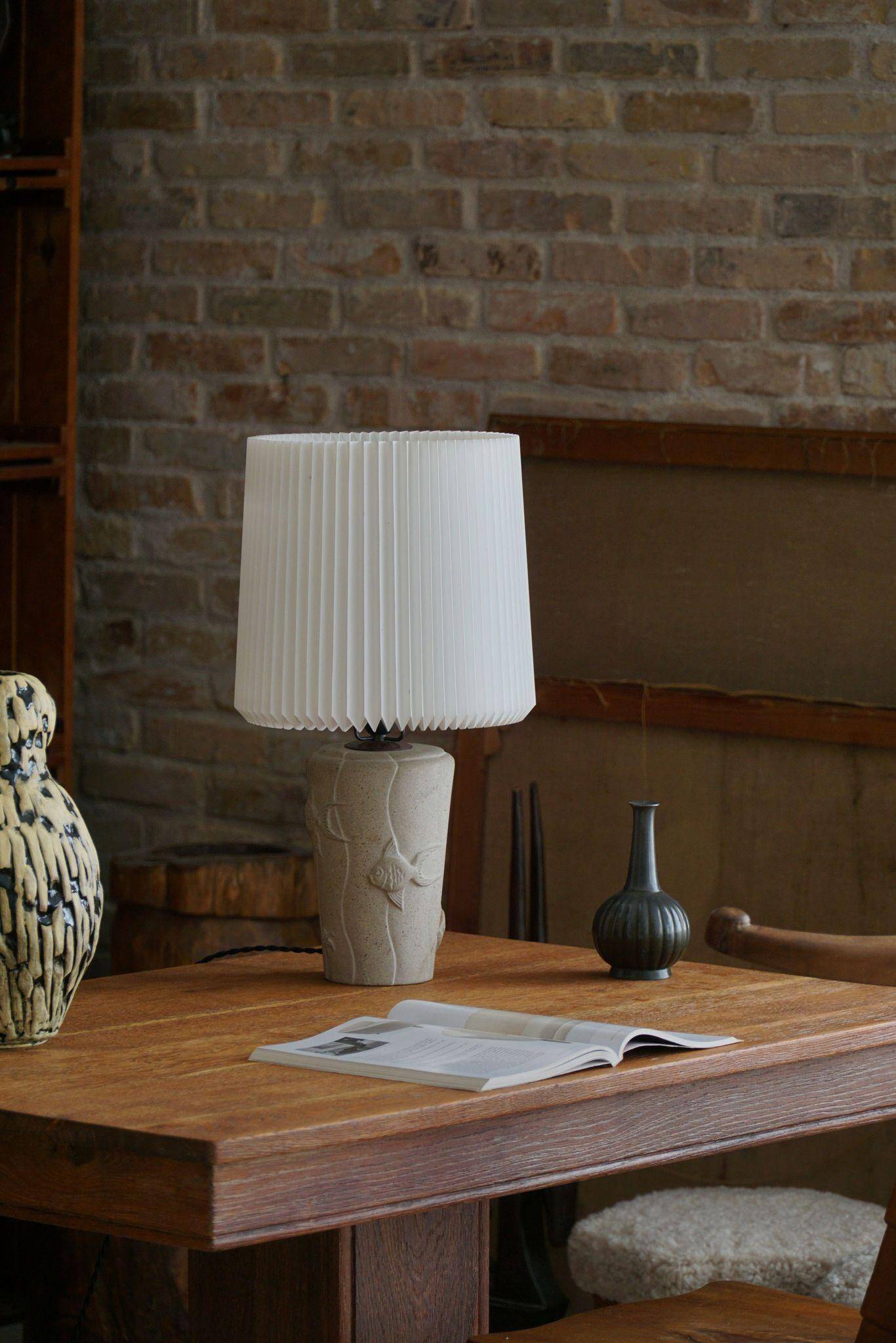 Modern vintage French table lamp, made of stone with fish patterns, 1970s.