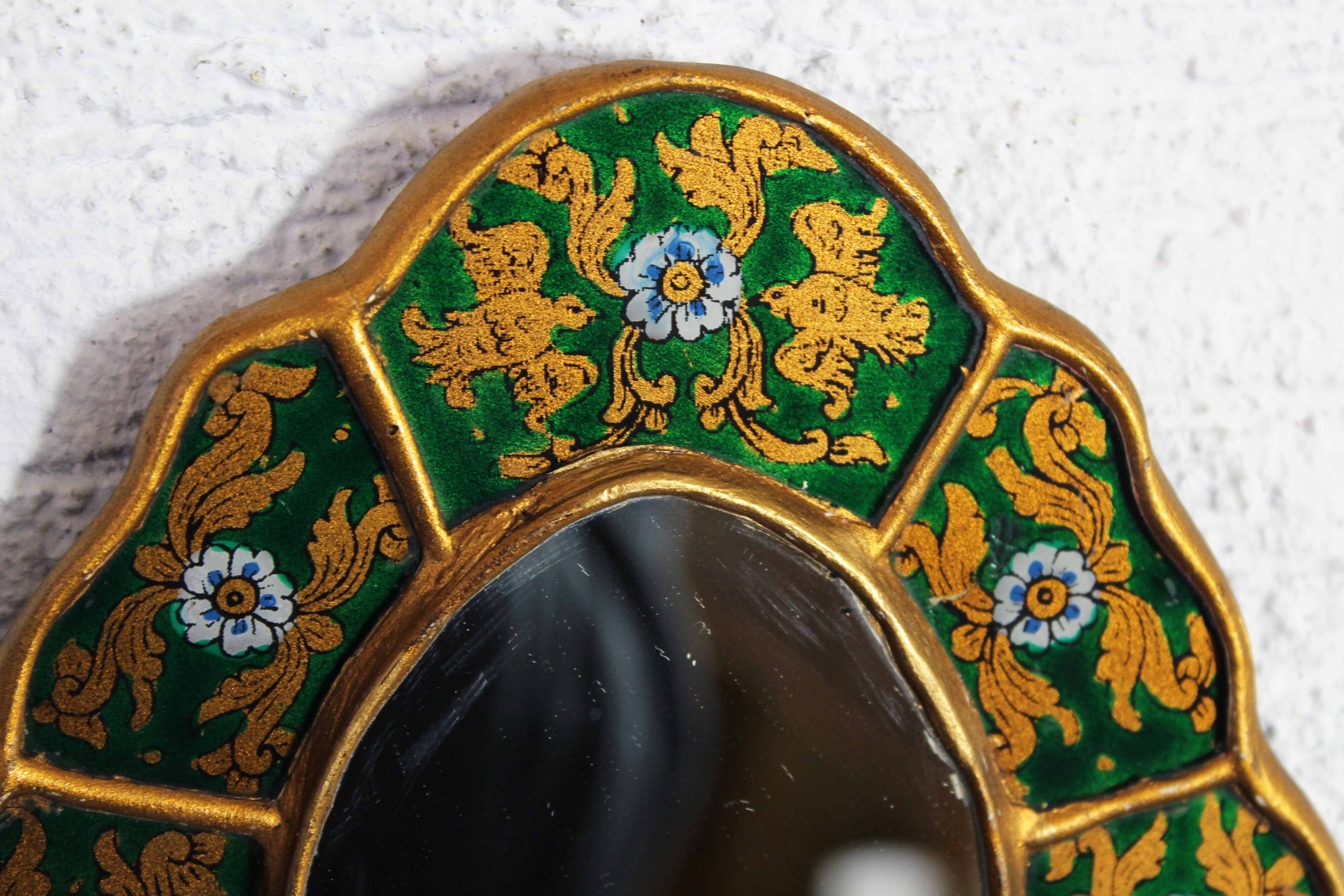 Golden mirror with decor