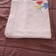 Vintage square linen tablecloth hand-embroidered with floral patterns — 1950s/60s