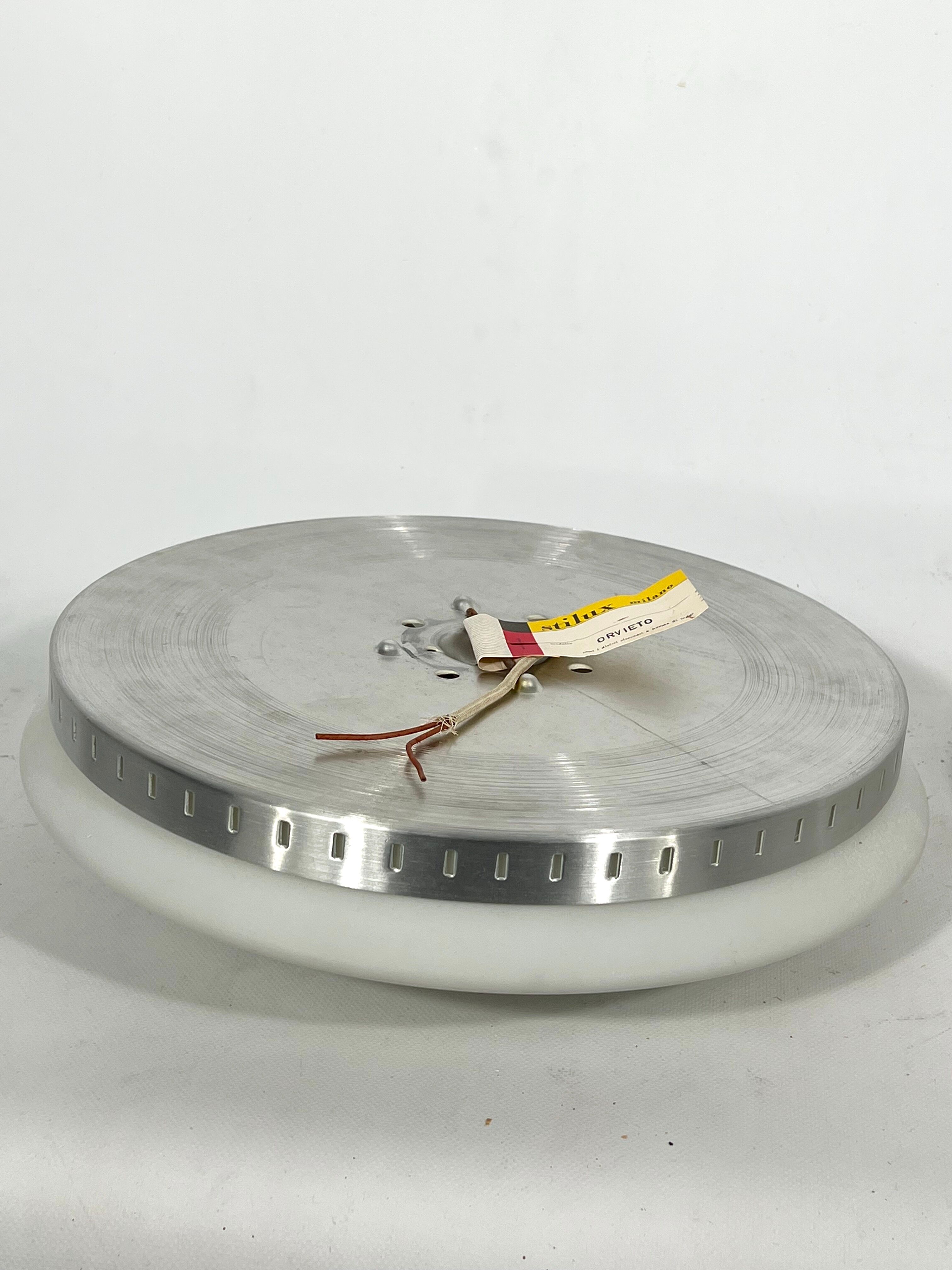 Stilux Milano, pair of round opaline glass ceiling lamps. 1960s