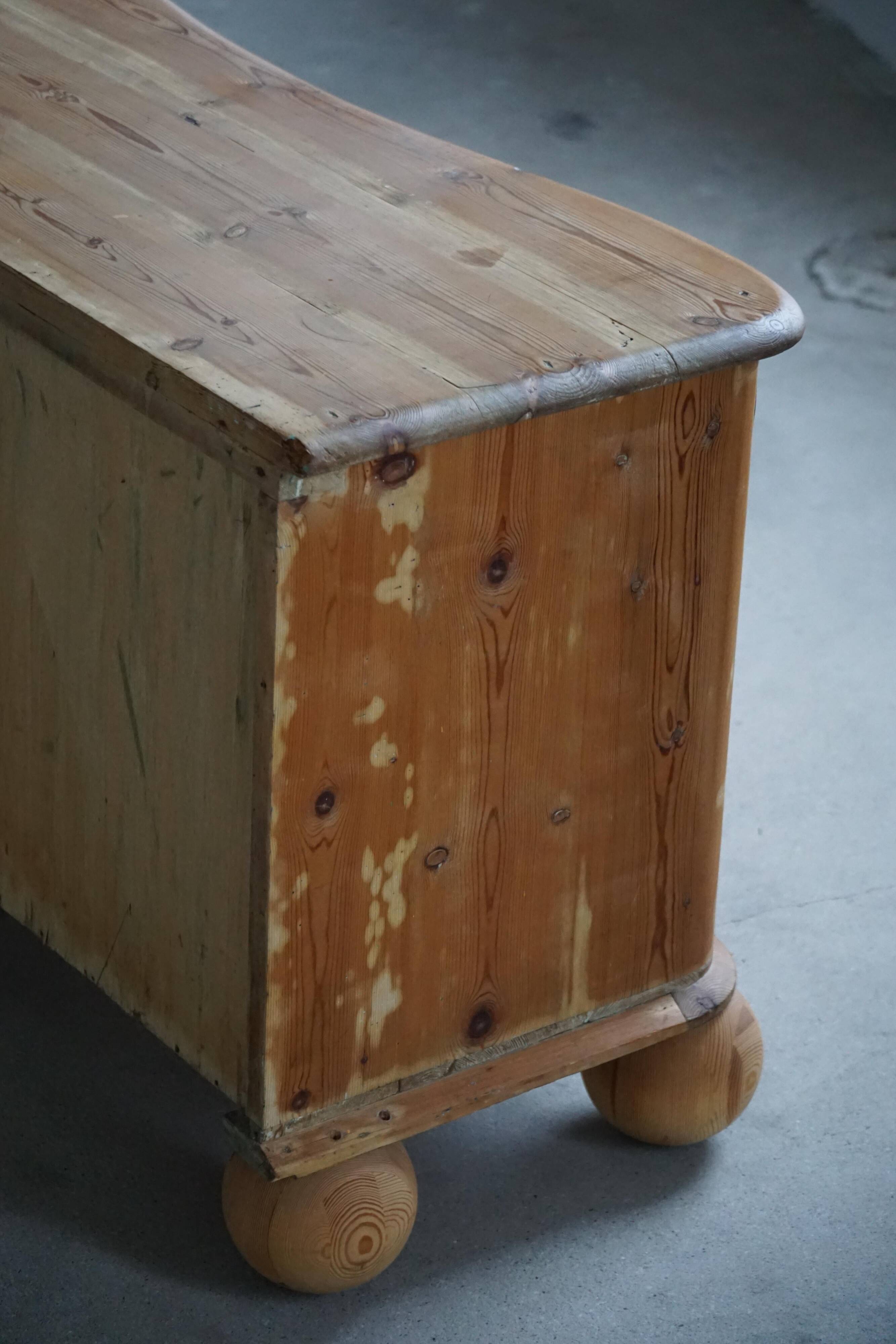 Antique Danish pine commode with ball feet, late 19th century.