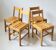 4 wooden chairs in the Charlotte Perriand style