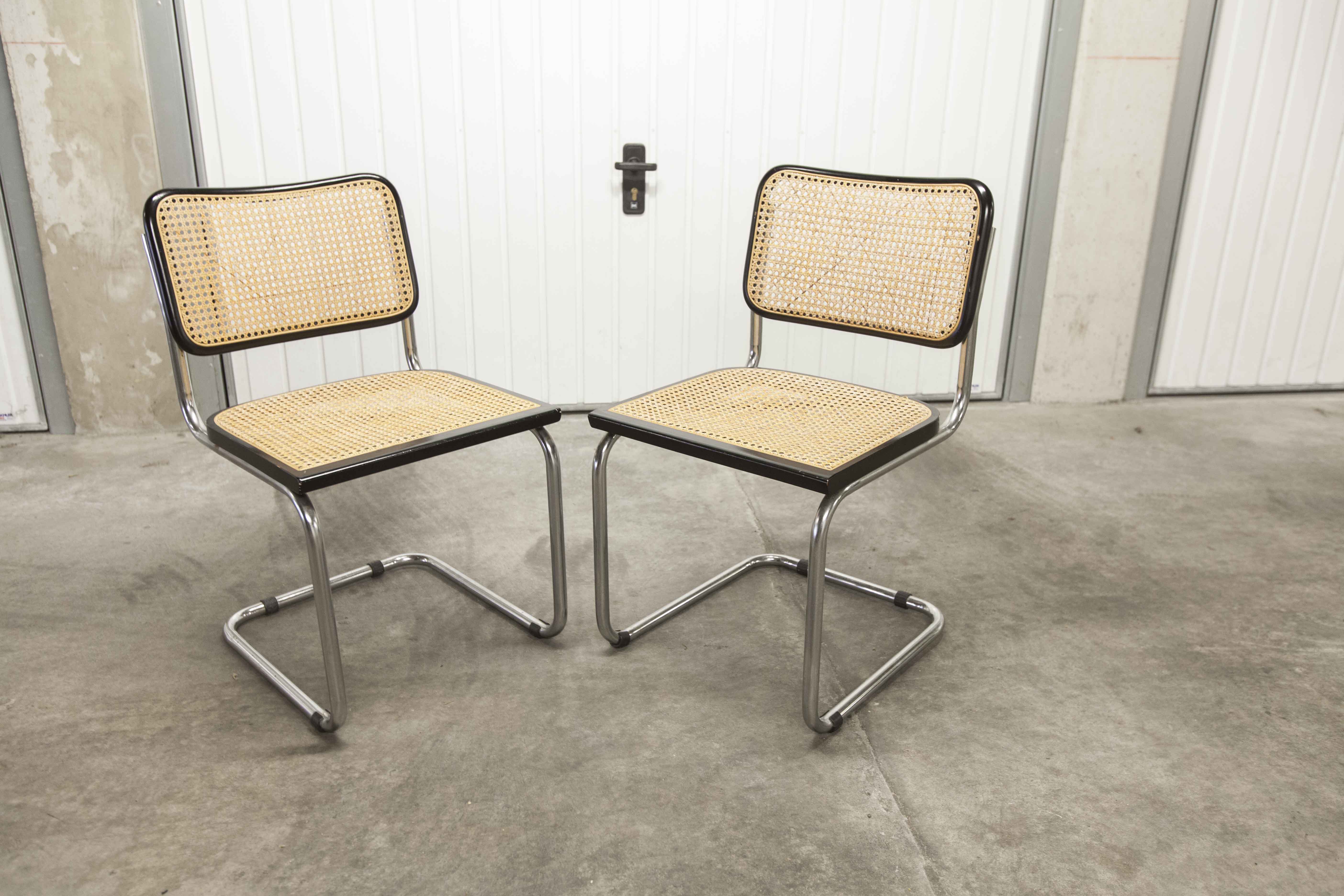 Pair of black Breuer b32 chairs and cannage