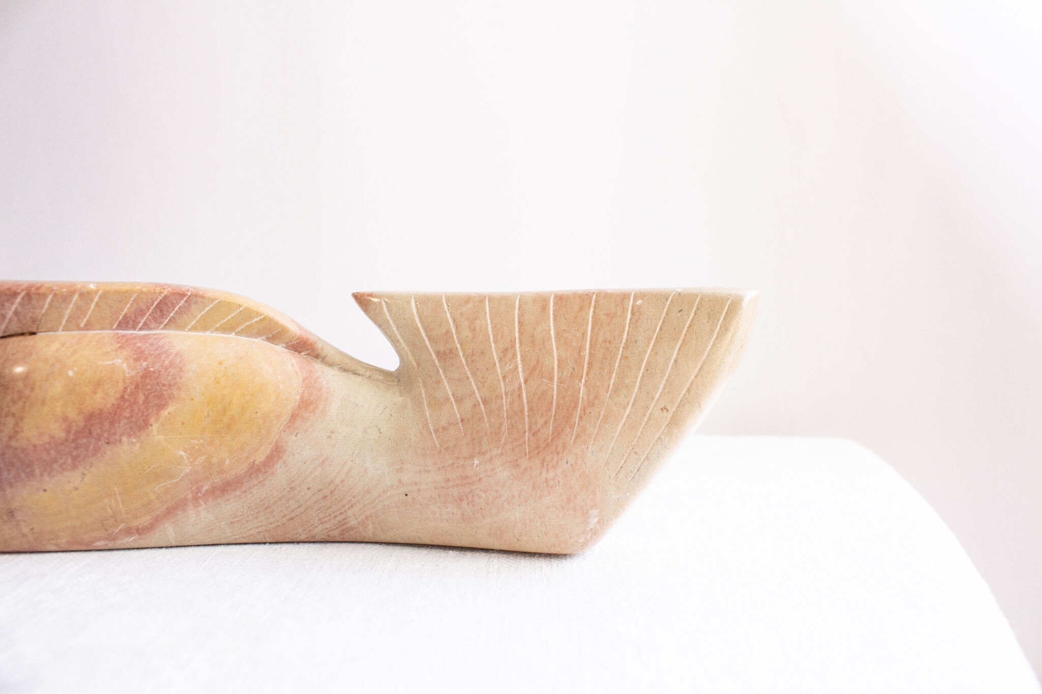 Inuit marble statuette. Primitive whale statue. Artifact from North America.