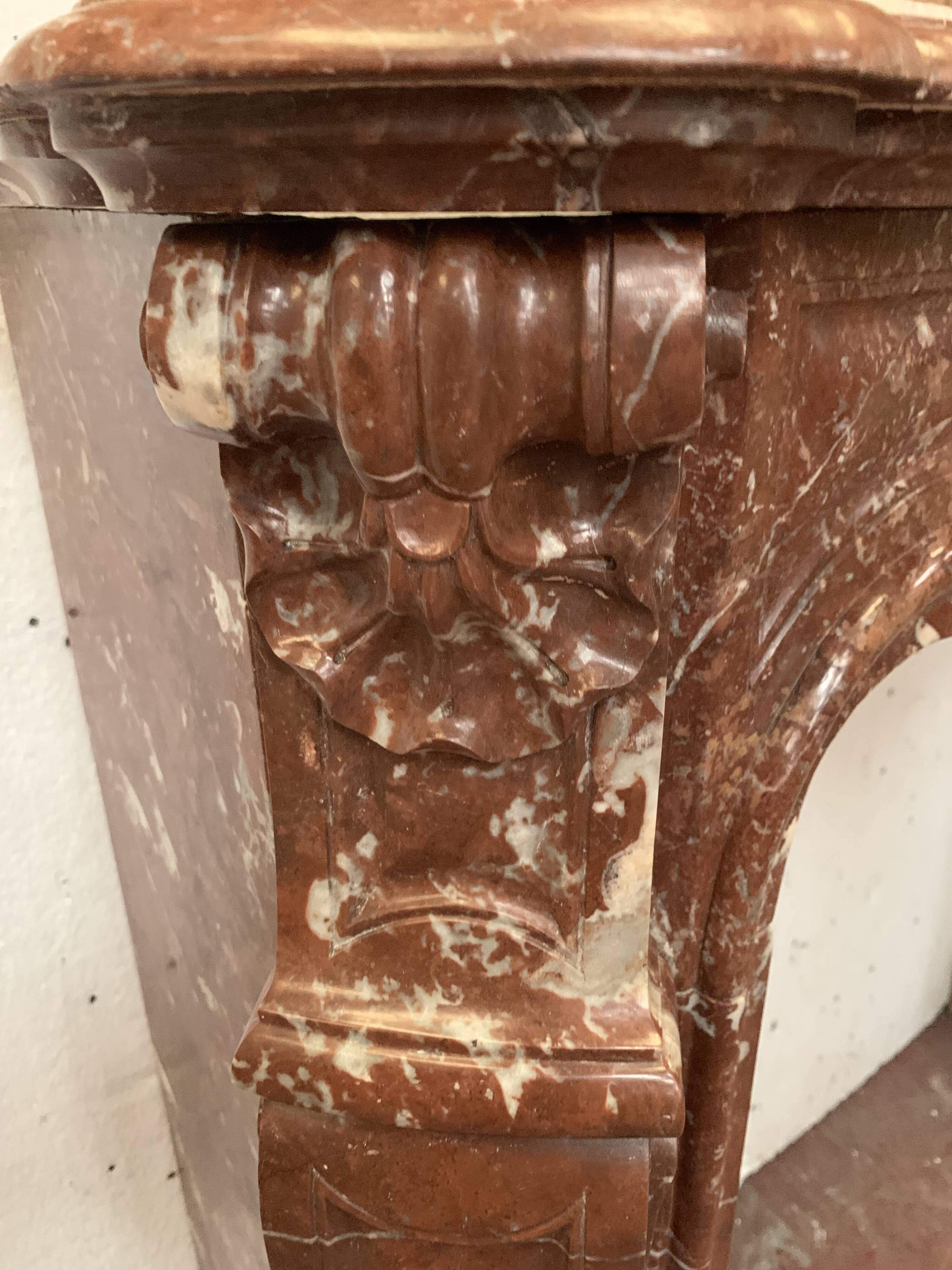 Fireplace three shells louis XV style in royal red marble XIX century