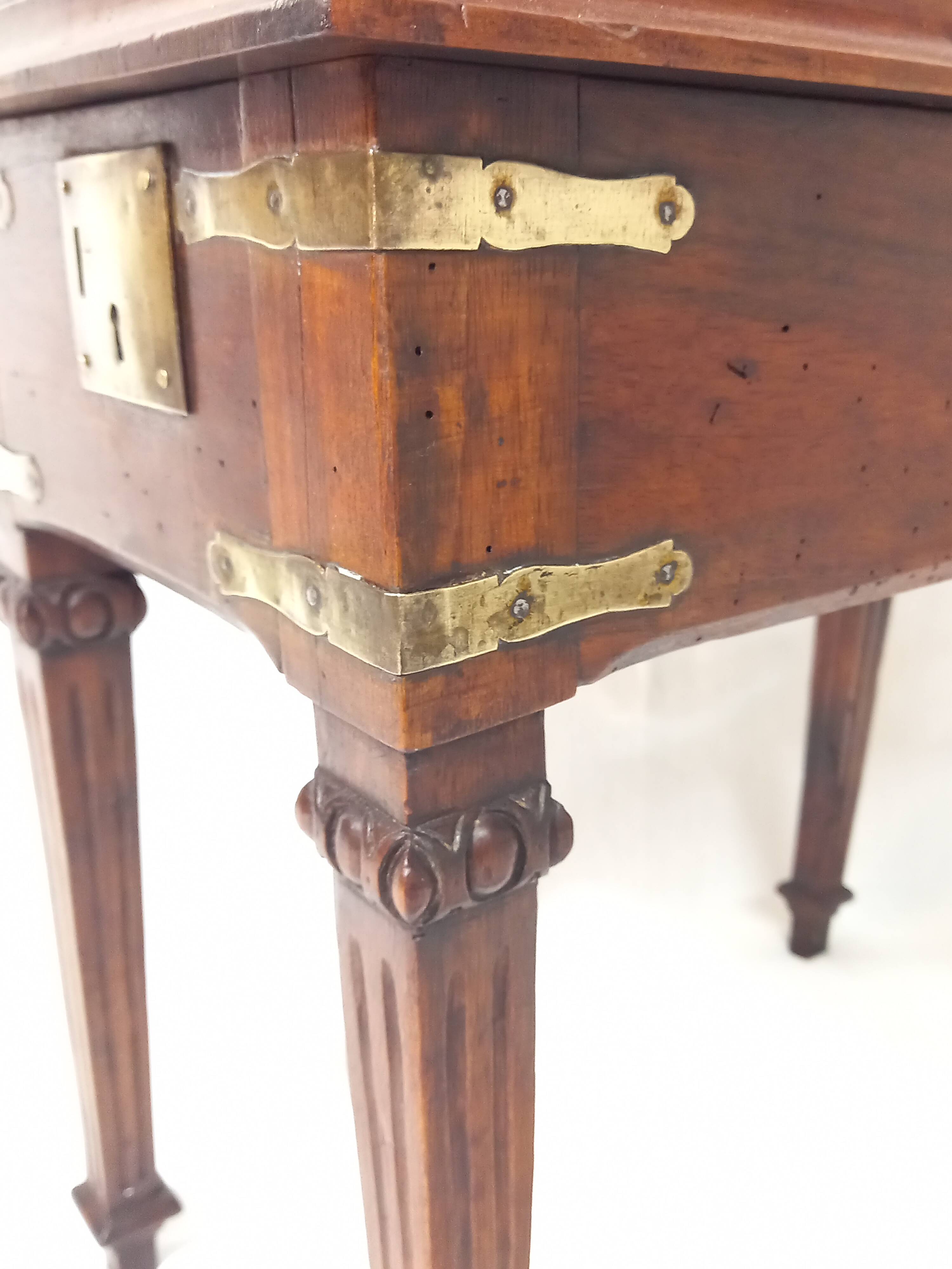 Small old side table with brass finishes