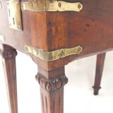 Small old side table with brass finishes