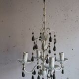 Antique white lacquered metal chandelier with wooden pendants.