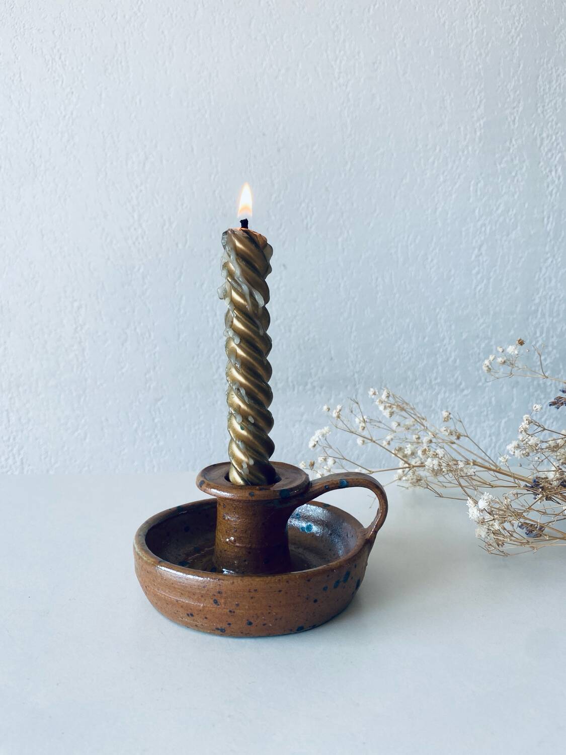 Signed sandstone candle holder