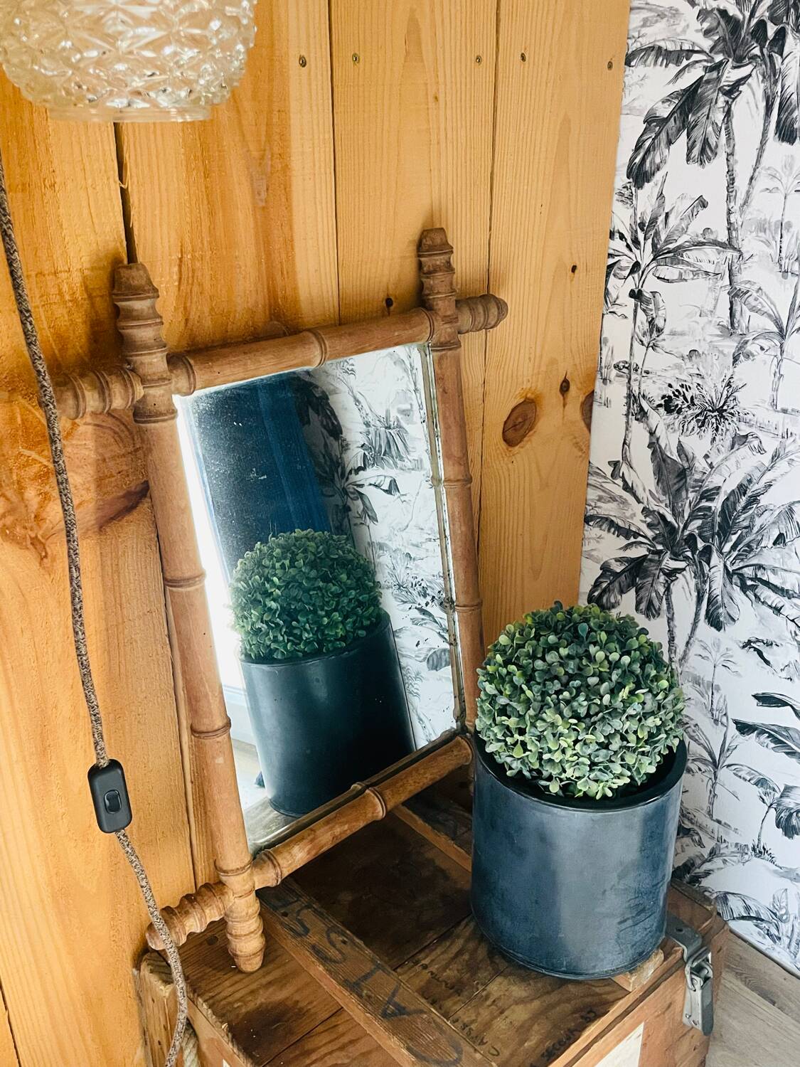 Carved wooden mirror in a bamboo style