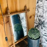 Carved wooden mirror in a bamboo style