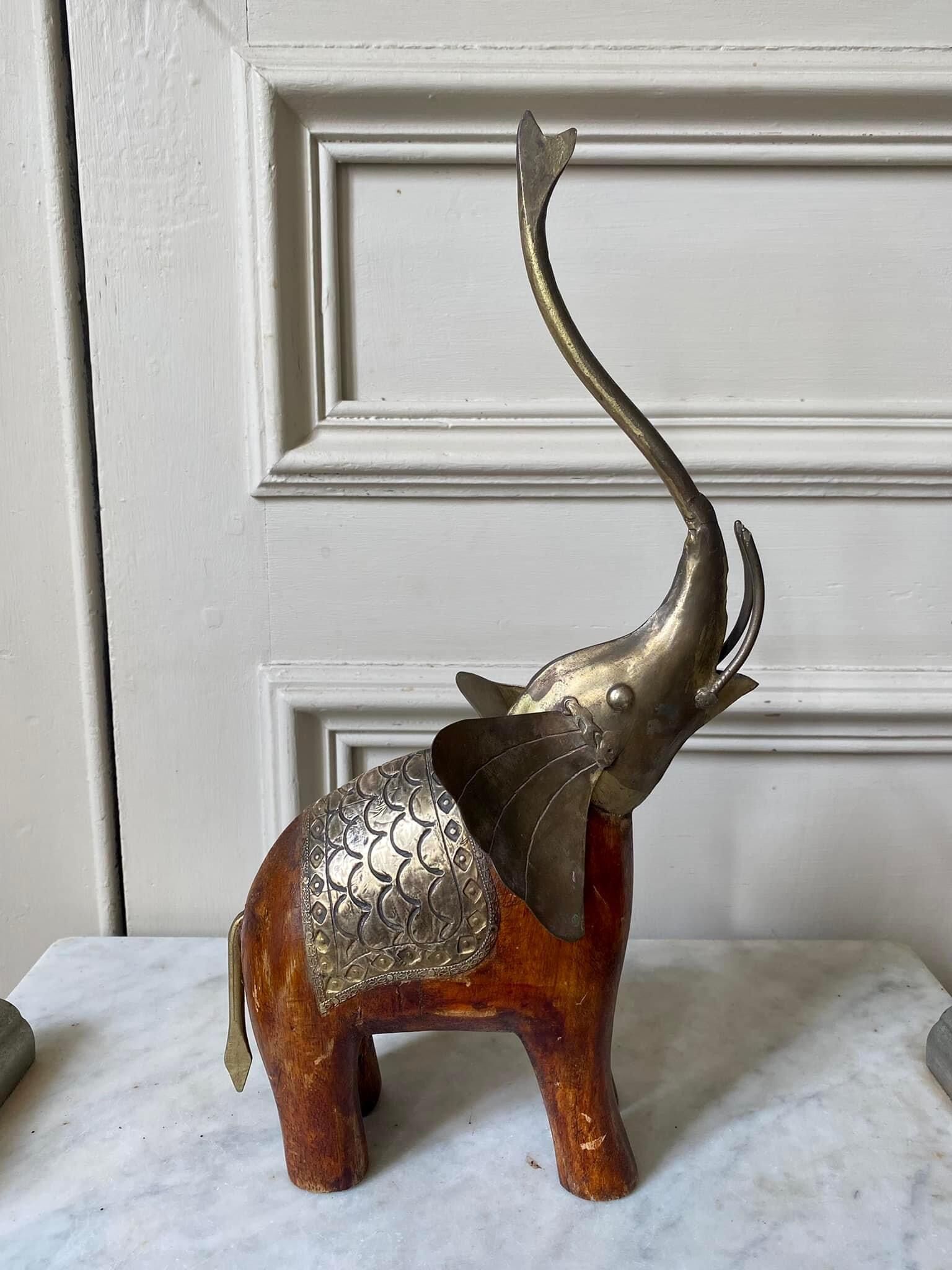 Wooden elephant and brass