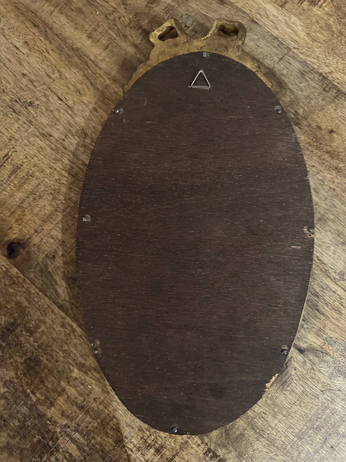 Oval gold knot mirror