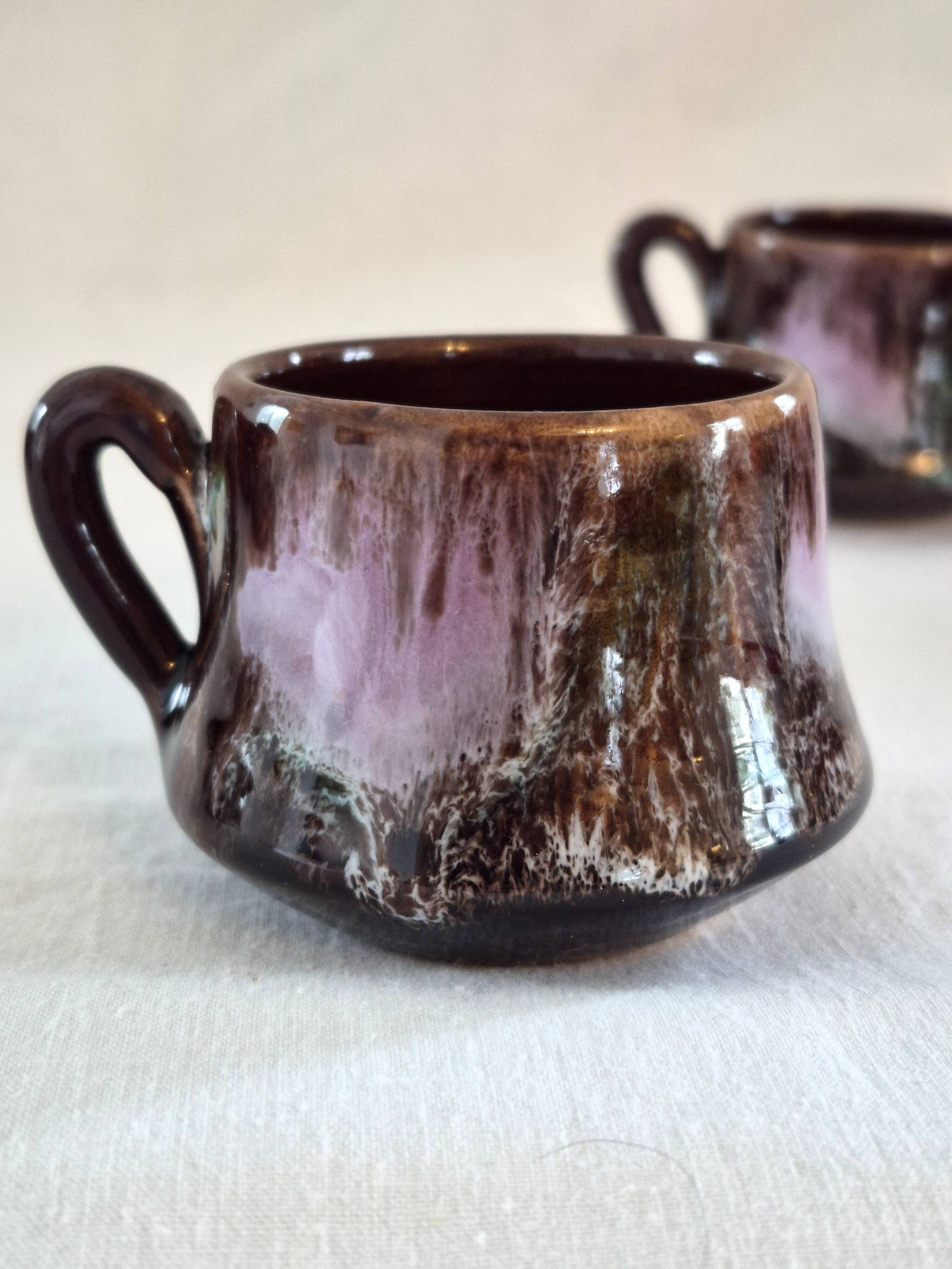 Six cups and saucers Vallauris glazed ceramic in brown and old pink.