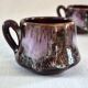 Six cups and saucers Vallauris glazed ceramic in brown and old pink.