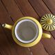 Teapot in yellow and black porcelain stamped Sarreguemines
