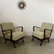 Set 2 old designer fireside chairs from the 50s wood and vintage fabric