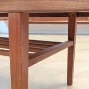 Vintage Danish coffee table in teak with a black top from the 1960s.