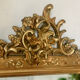 Gilded fireplace mirror with pediment
