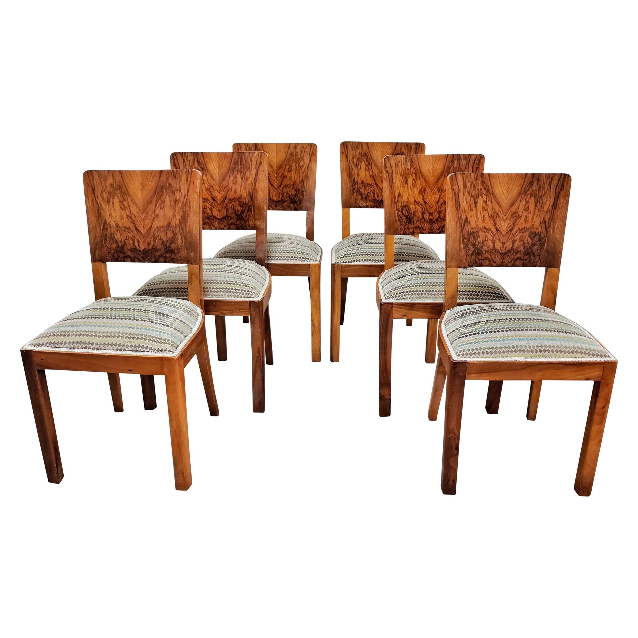 Set of six Art Deco dining chairs in walnut root veneer, 1940s.