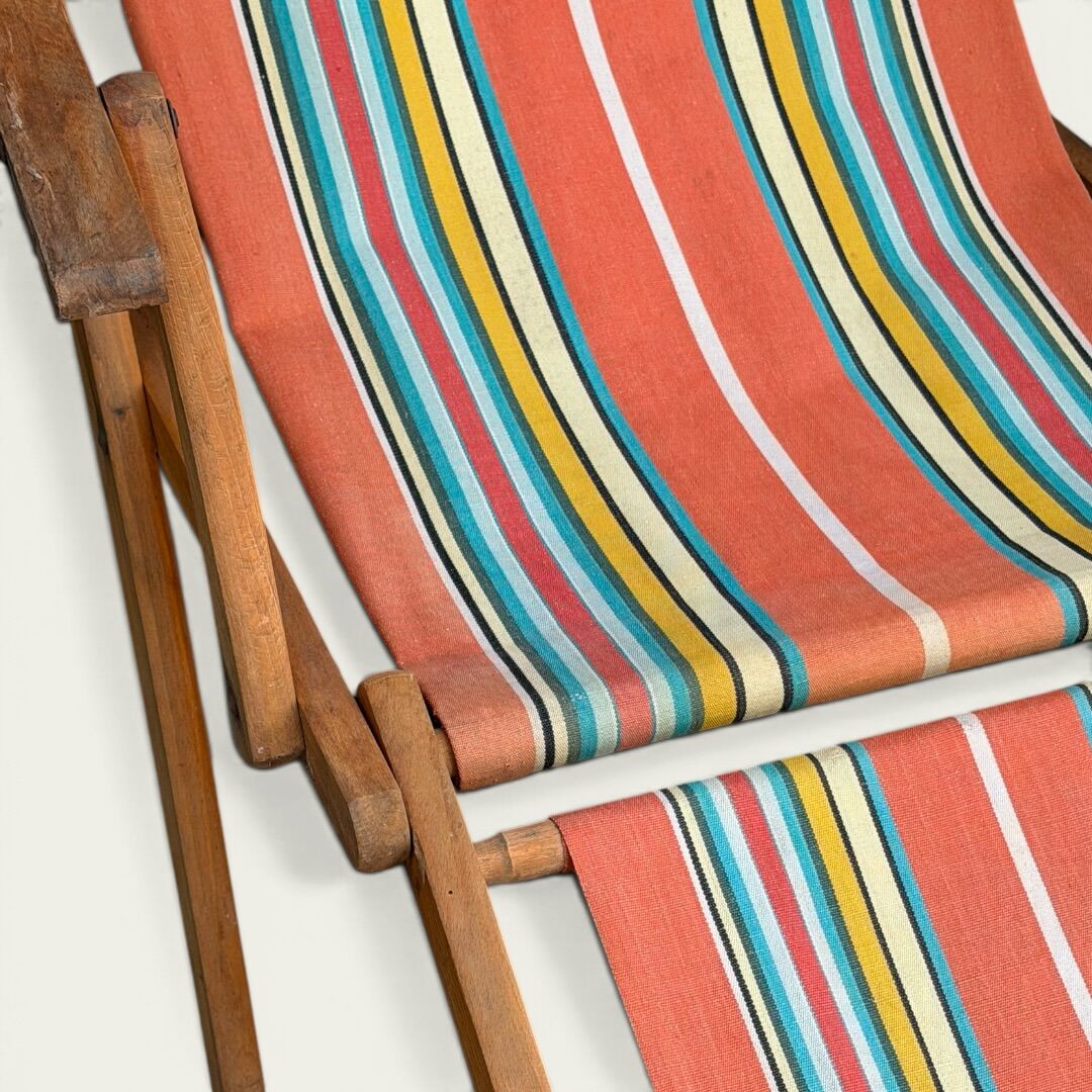 Vintage striped multicoloured deck chair with original patina.