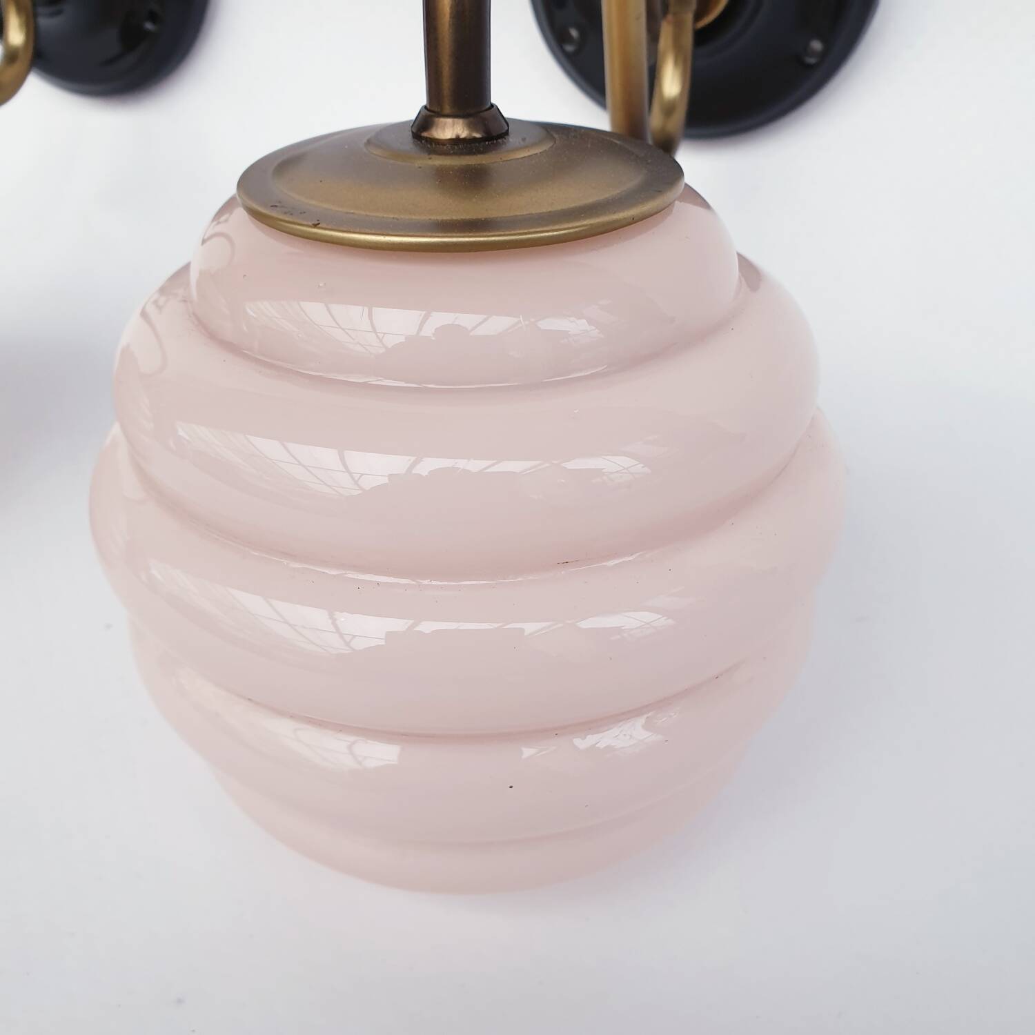 Swan neck wall lights in brass and glass