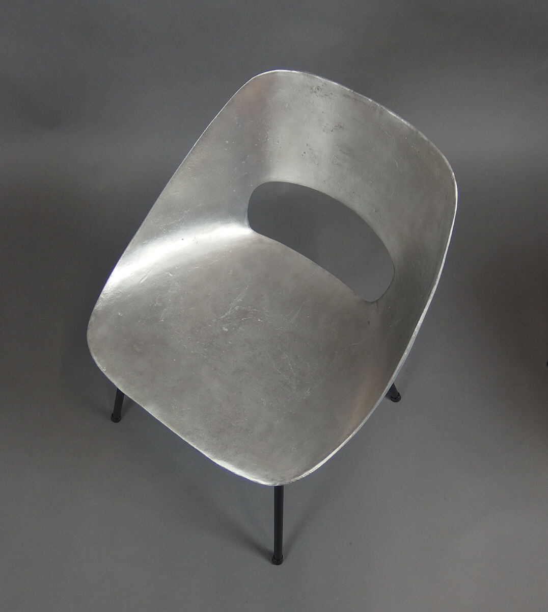 Four aluminium chairs by Pierre Guariche