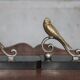 Vintage bookends, brass bird on black marble base, brass animals