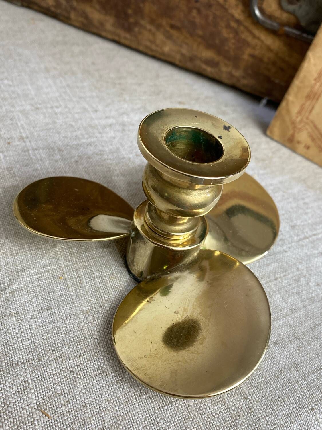 Pair of vintage brass propeller-shaped candlesticks