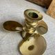 Pair of vintage brass propeller-shaped candlesticks