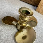 Pair of vintage brass propeller-shaped candlesticks