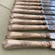 Series of 12 silver metal table knives, Ercuis Goldsmith