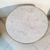 Coffee table with a veined white marble top
