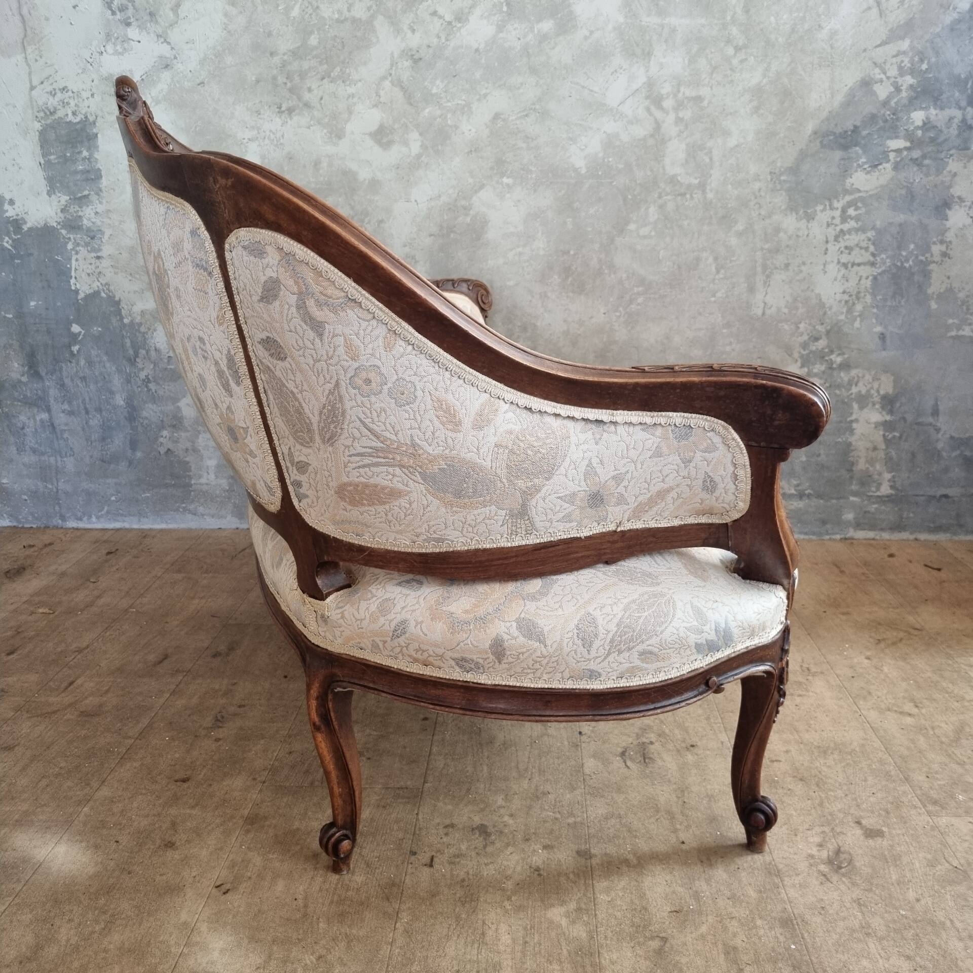 Small sofa or bench in Louis XV style, rococo.