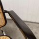Fauteuil b64 Breuer noir cannage accoudoirs et tampons neufs