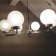 Six-light chrome metal chandelier and opaque glass globes / vintage 60s and 70s
