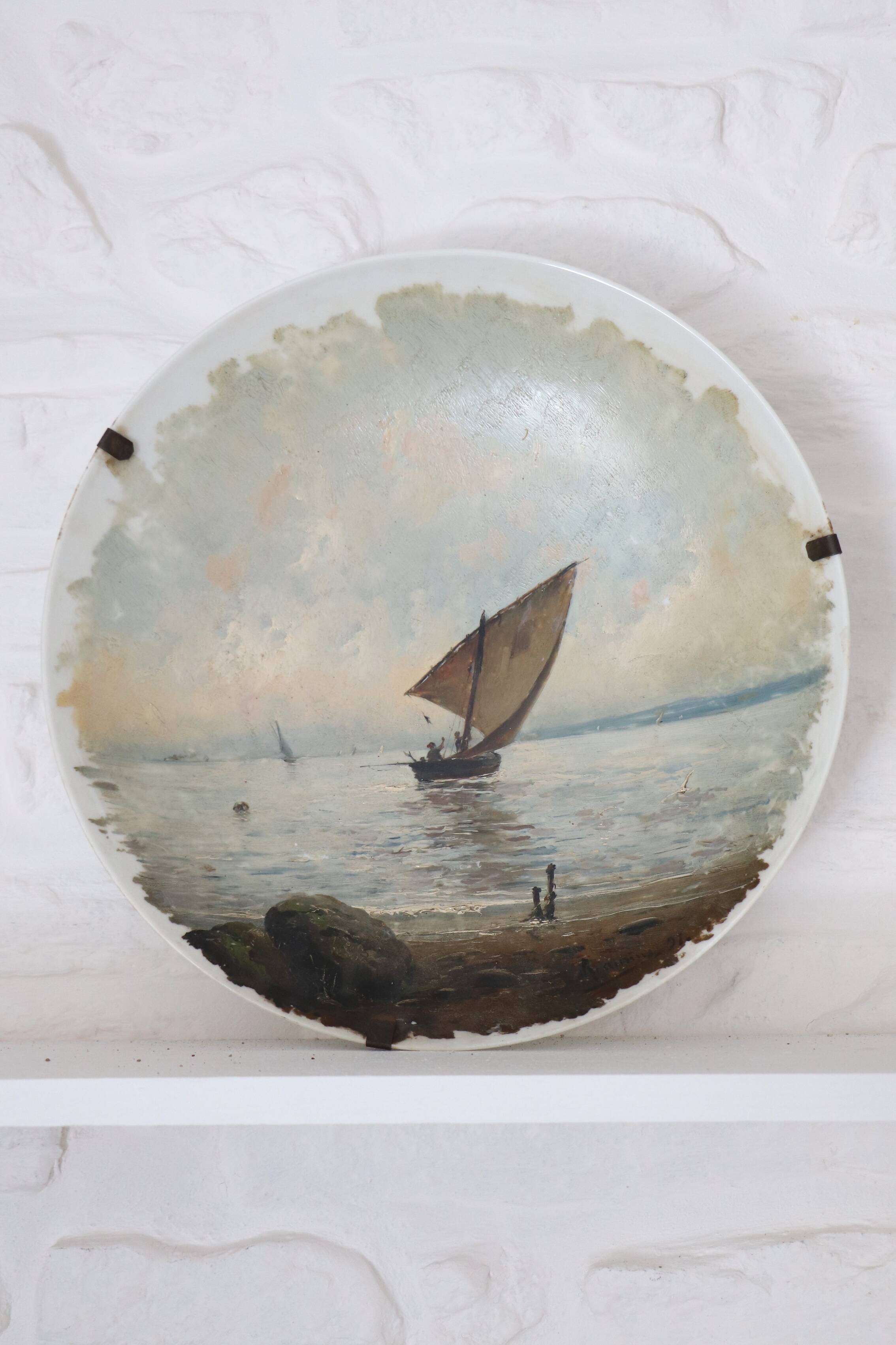 Pair of large hand-painted plates, sailing boat and landscape – late 19th century