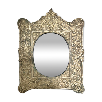 Baroque mirror in repoussé brass