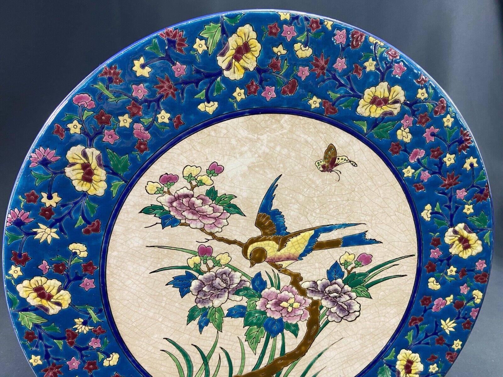 Large circular earthenware dish from Louvière with Longwy style bird decoration