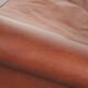 Cognac-coloured cow leather wingback armchair in English style