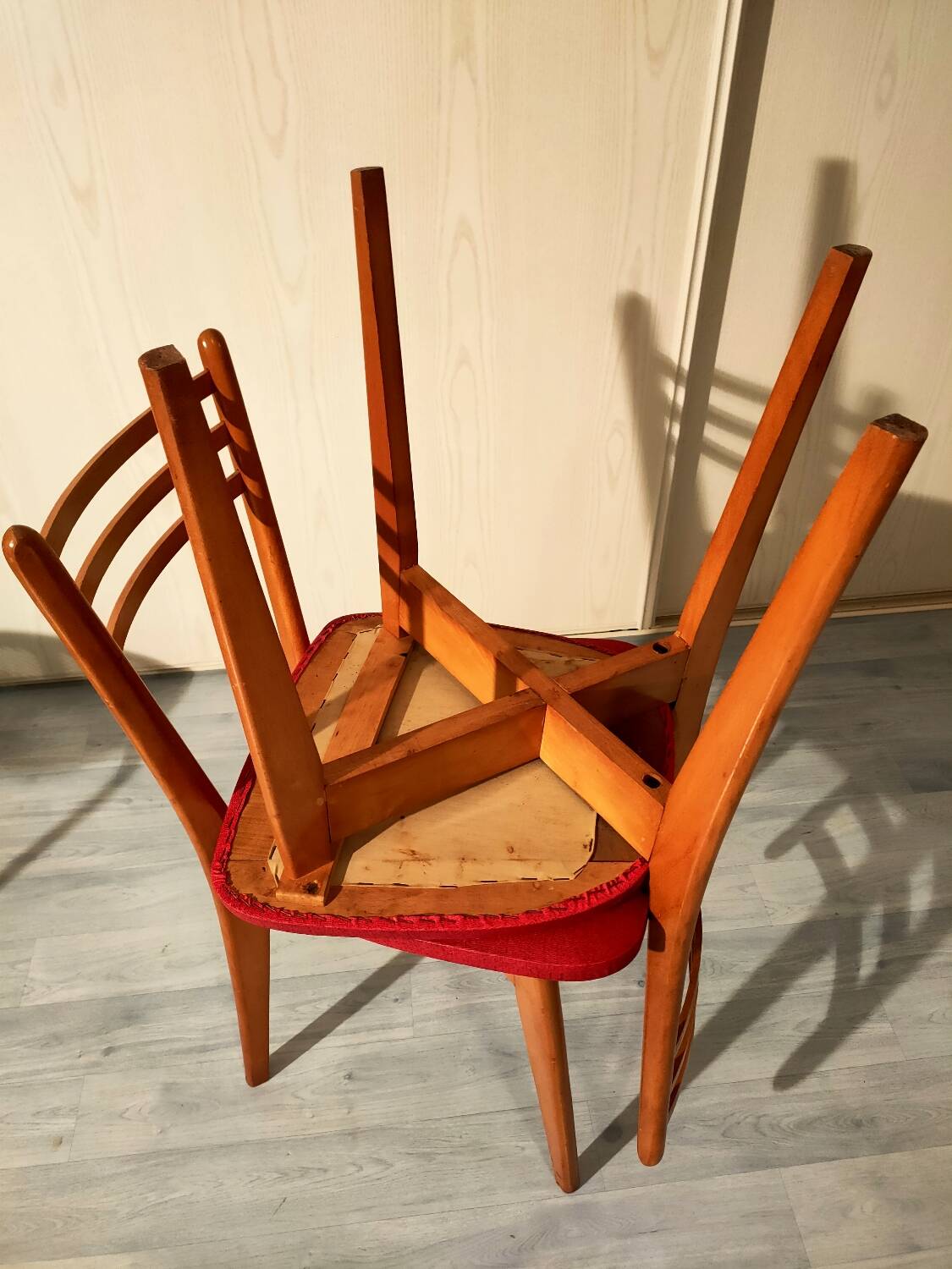 Pair of vintage wooden and leatherette chairs