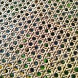 Four trendy tanned wooden chairs