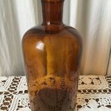 Old thick glass amber bottle