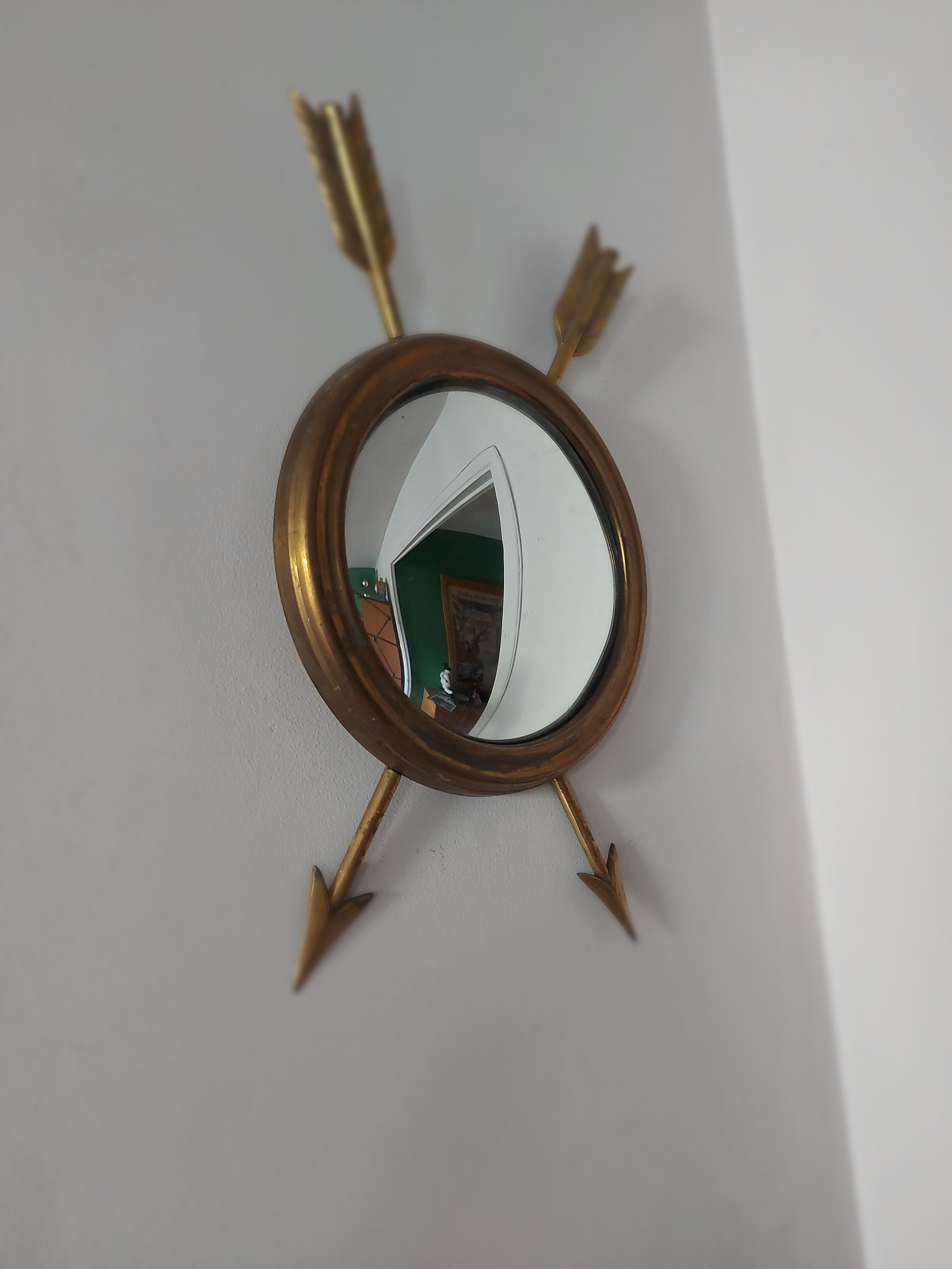 Curved brass witch's mirror