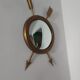 Curved brass witch's mirror
