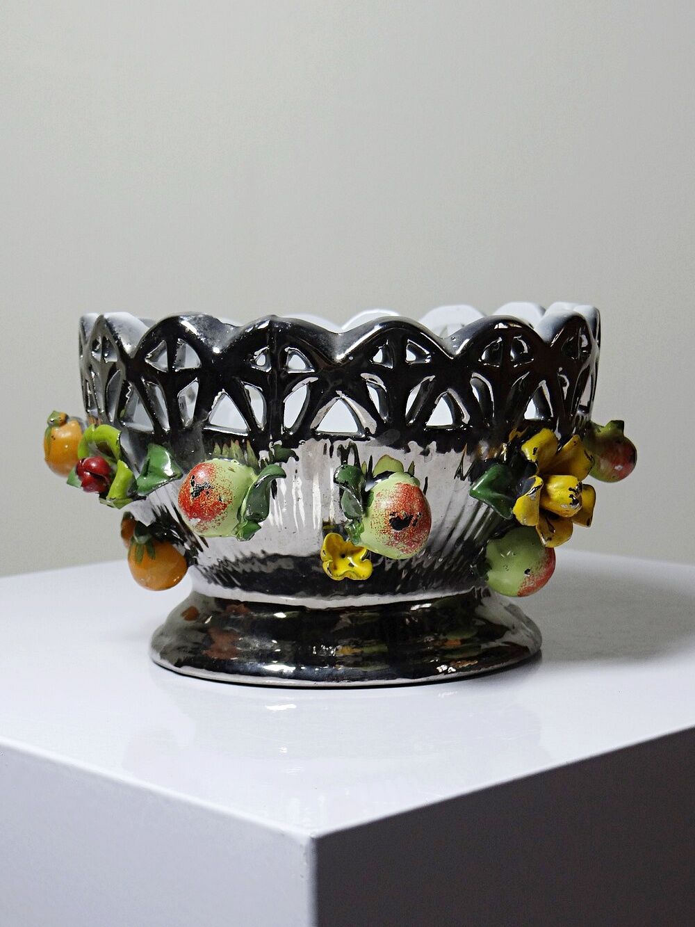 Vintage Italian silver-plated porcelain bowl with cut-out design of fruits and flowers.