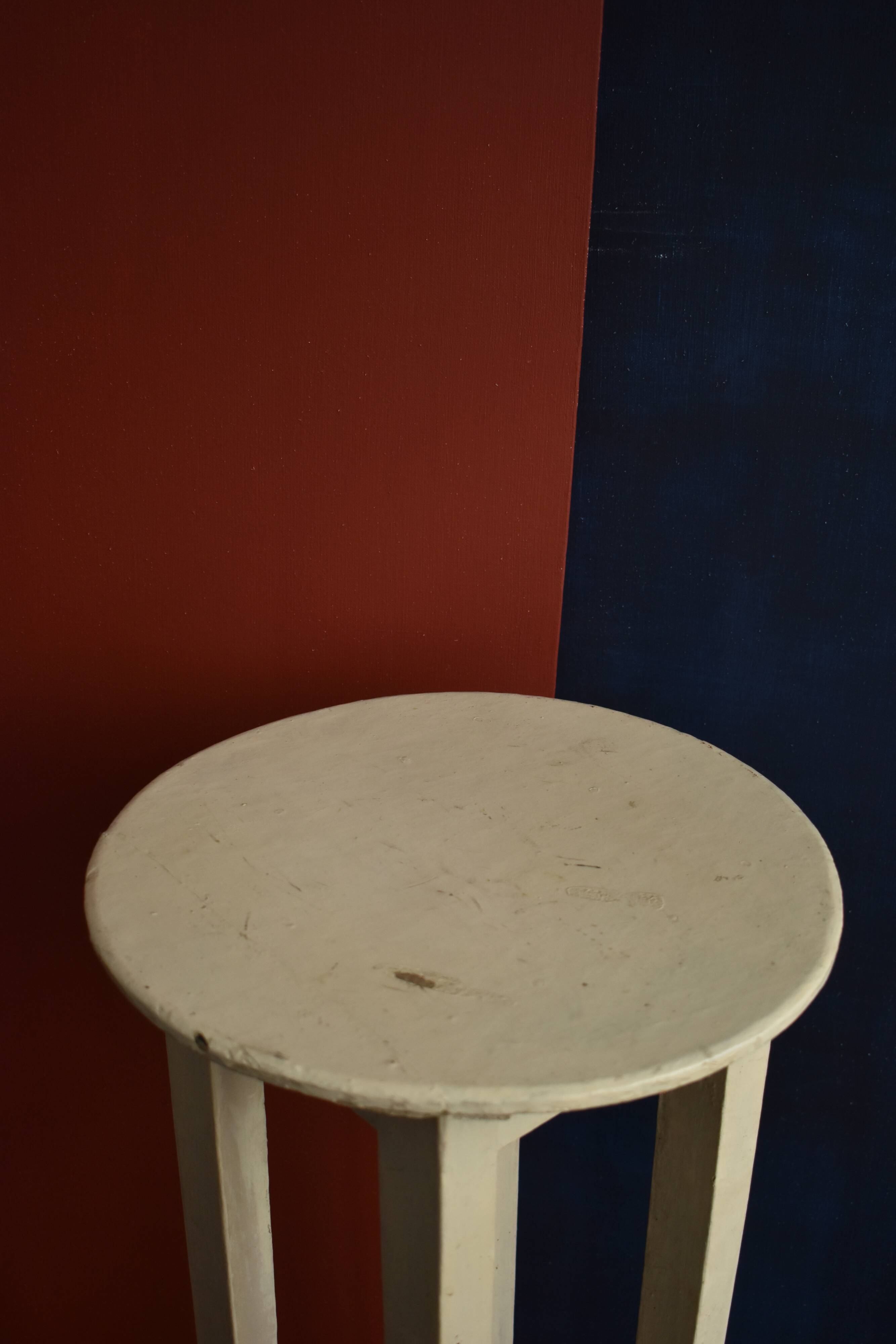 Old off-white wooden side table